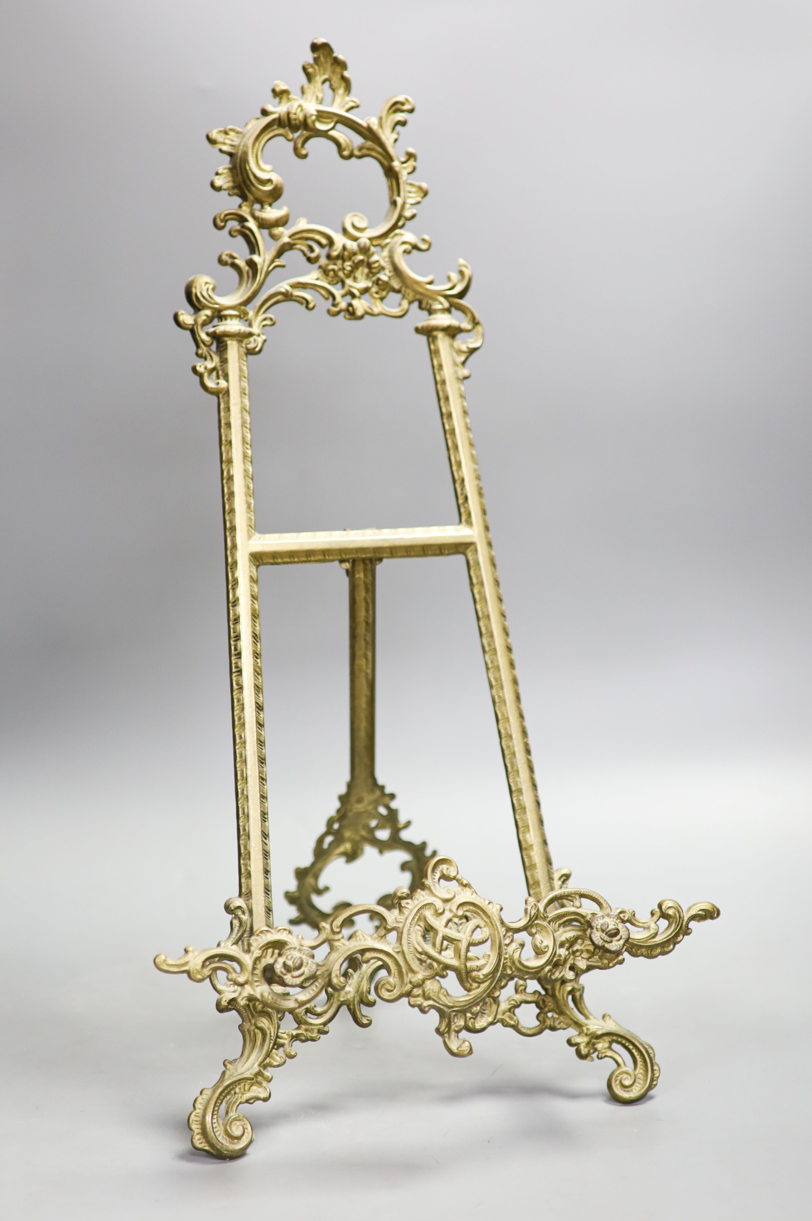 A cast brass easel 55cm